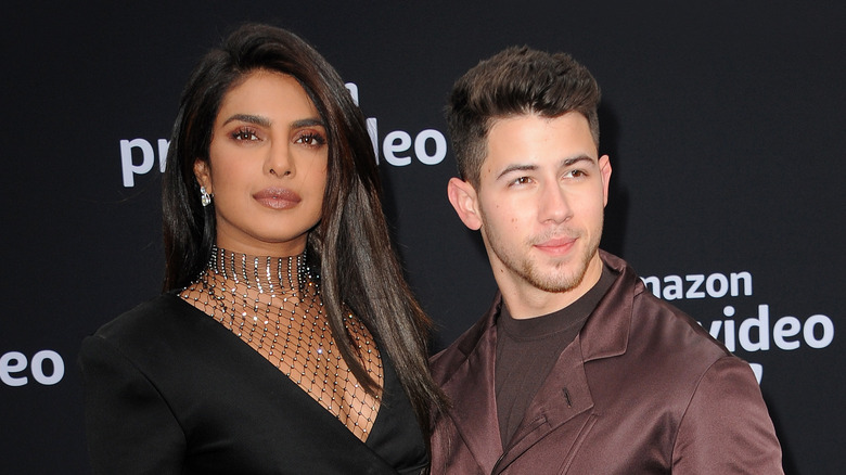 Nick Jonas posing with Priyanka Chopra posing