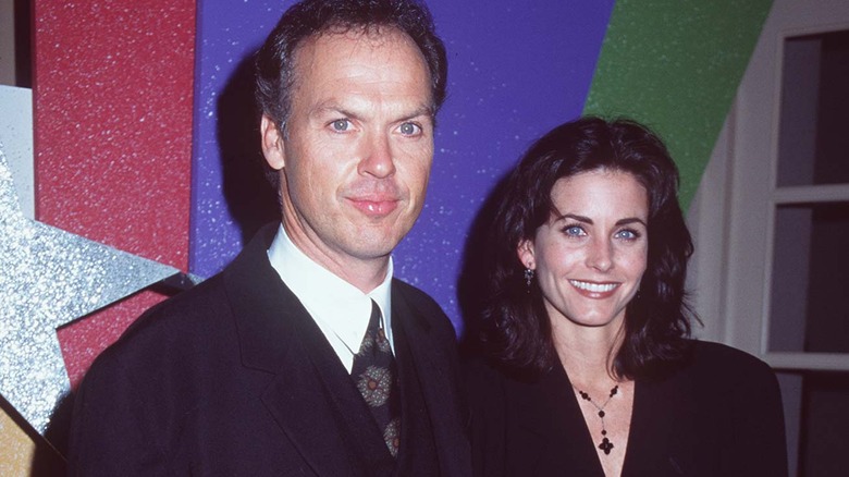 Michael Keaton and Courteney Cox smiling