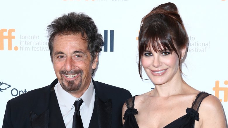 Al Pacino and Lucila Sola smiling on the red carpet