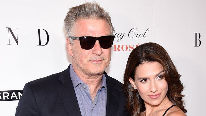 Alec Baldwin and Hilaria Thomas posing together on the red carpet
