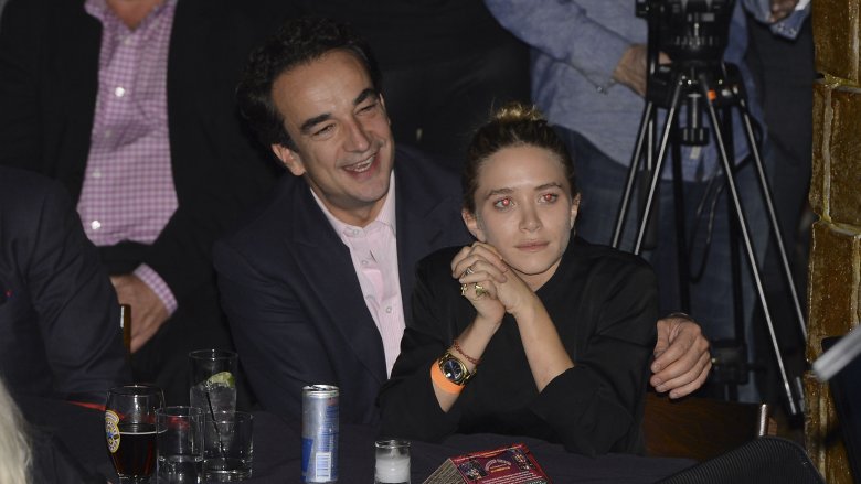 Olivier Sarkozy with his arm around Mary-Kate Olsen