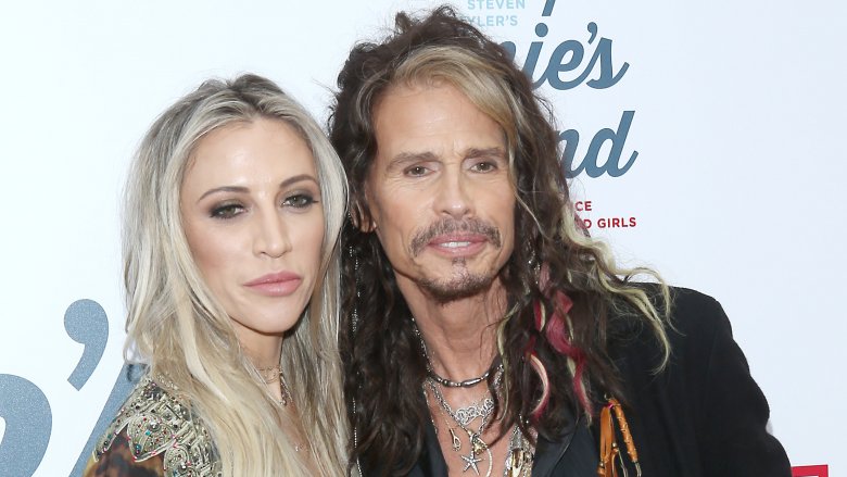 Aimee Preston, Steven Tyler pose at event