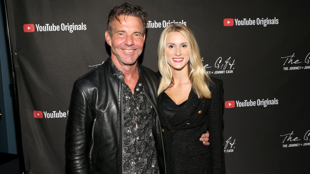 Dennis Quaid and Laura Savoie posing together on the red carpet