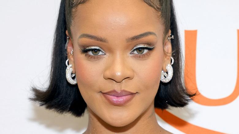 Rihanna silver eyeshadow, smiling softly