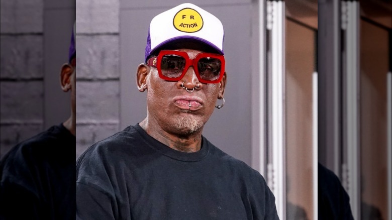 Dennis Rodman in hat and glasses