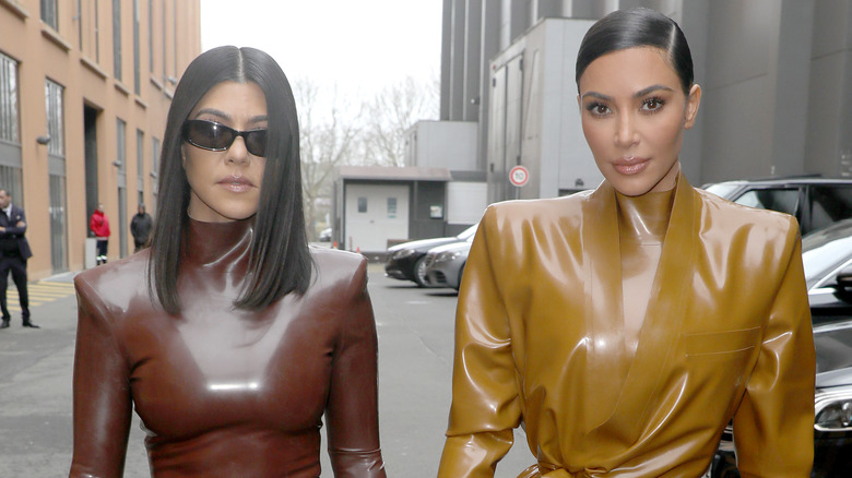 Kourtney and Kim Kardashian walking in Paris