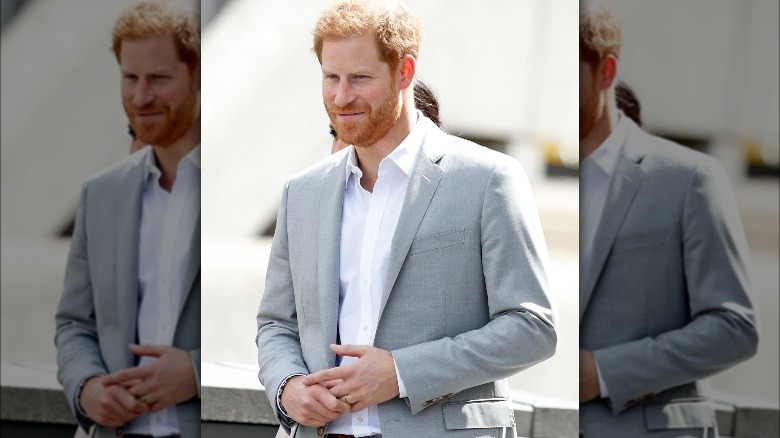 Prince Harry touching wedding ring