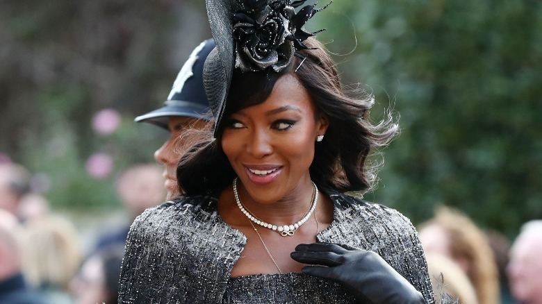 Naomi Campbell wearing hat and gloves