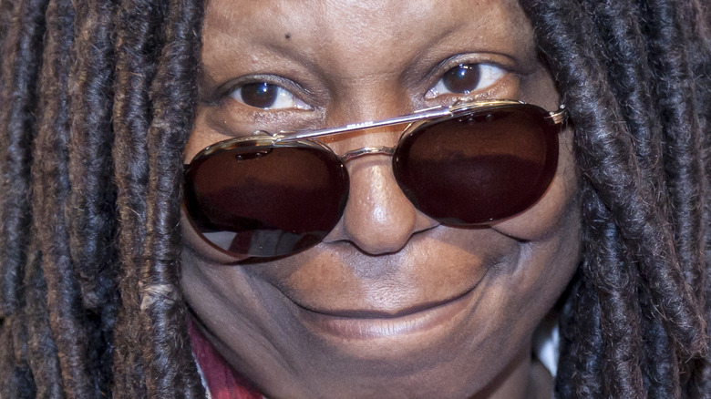 Whoopi Goldberg grinning