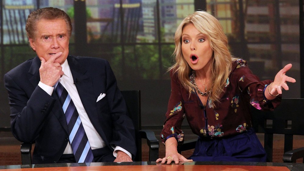 Regis Philbin and Kelly Ripa at the desk on Live
