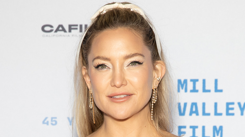 Kate Hudson at an event, slightly smiling