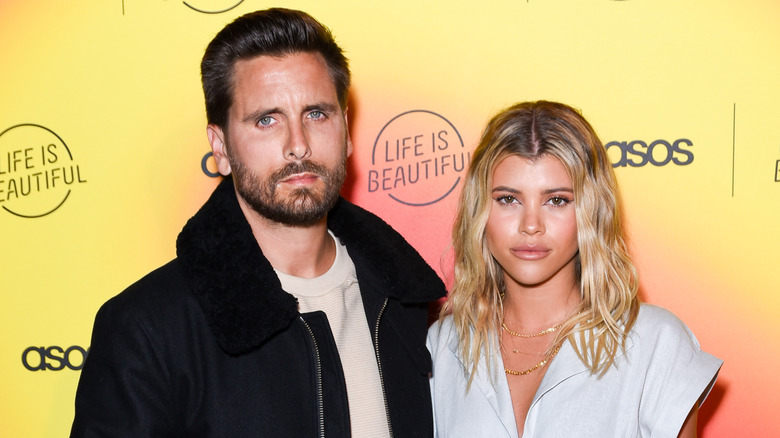 Scott Disick, Sofia Richie with morose expressions