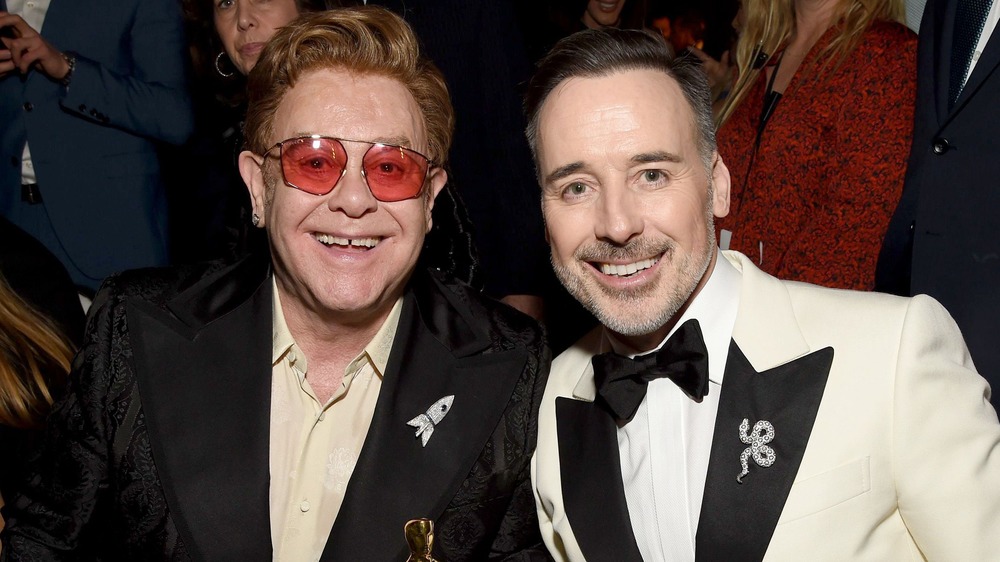 Elton John and David Furnish smiling