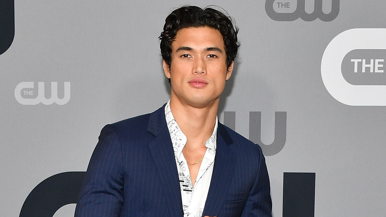 Charles Melton in blue suit