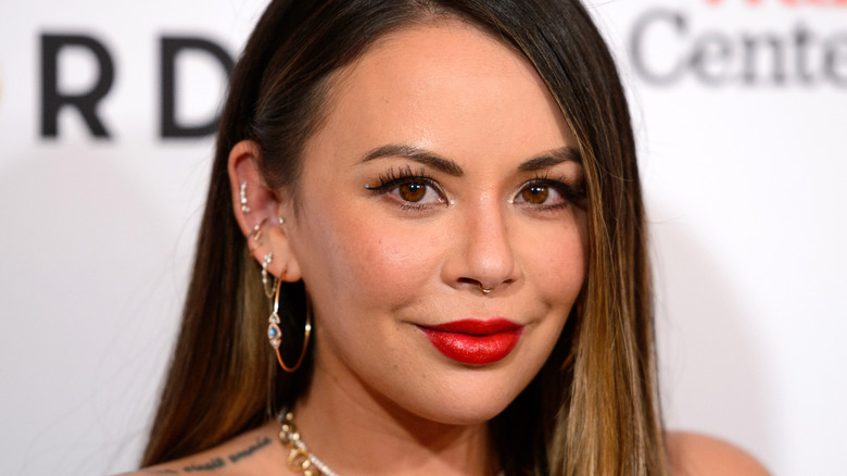 Janel Parrish posing at an event