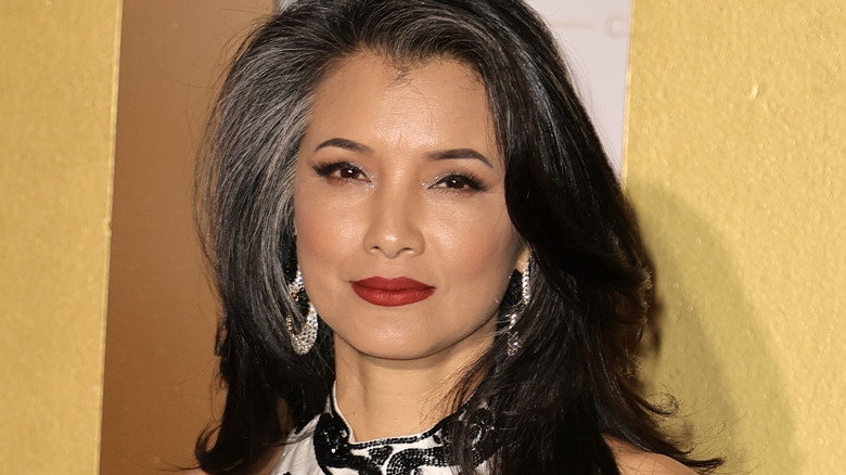 Kelly Hu posing at an event