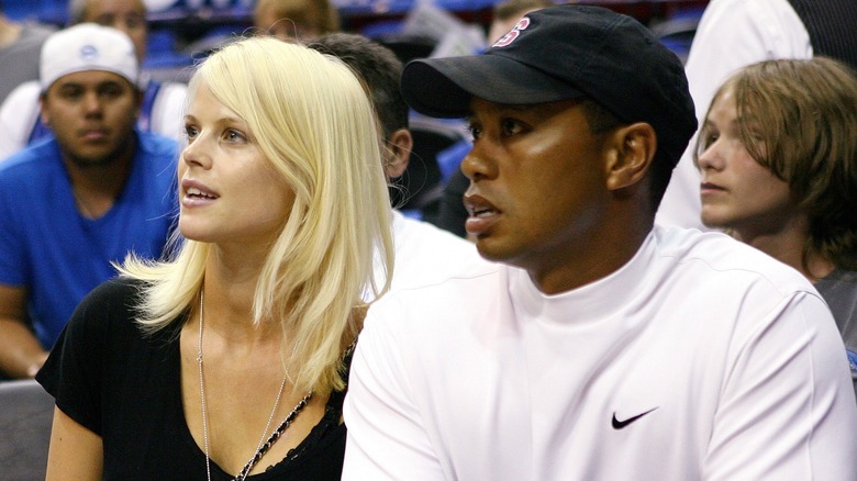 Elin Nordegren and Tiger Woods attending an event