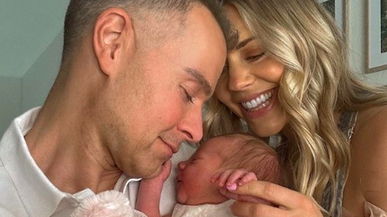 Joey Lawrence and Samantha Cope holding newborn