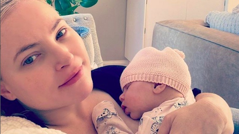 Meghan McCain holding baby daughter