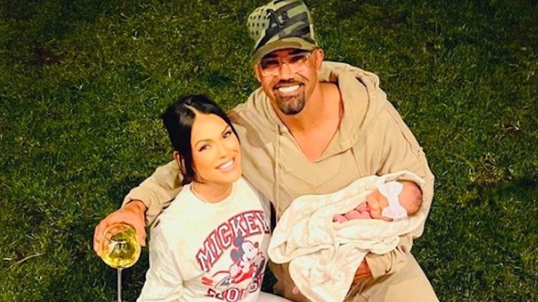 Jesiree Dizon, Shemar Moore and baby Frankie smiling