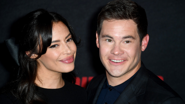 Adam DeVine and Chloe Bridges smiling 