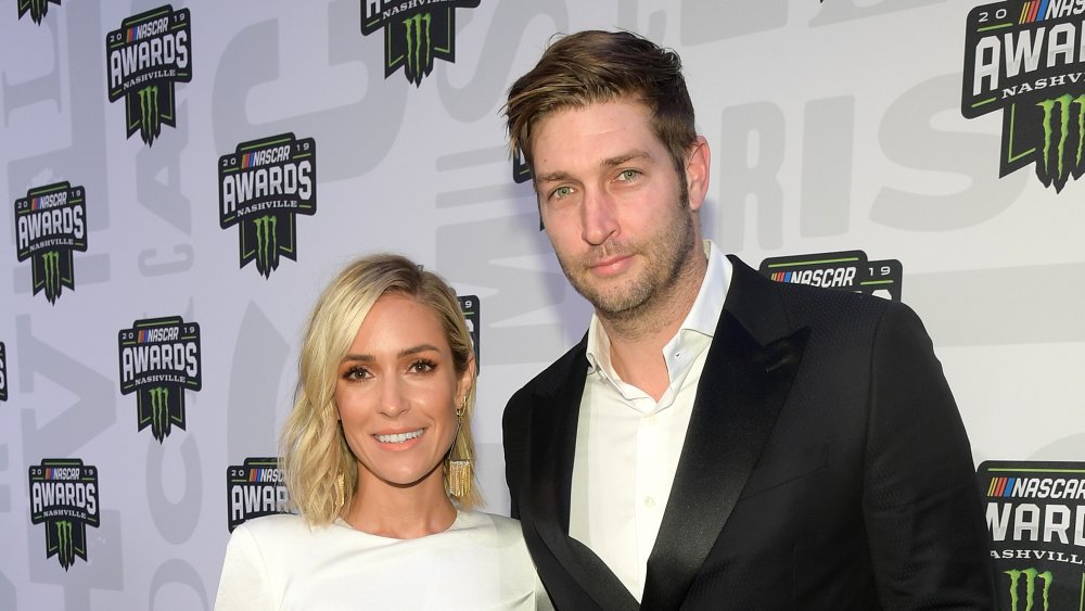 Kristin Cavallari smiling next to Jay Cutler at the NASCAR Awards