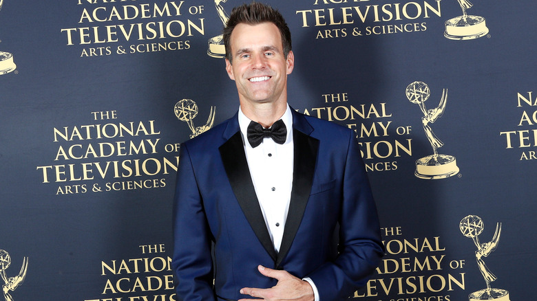 Cameron Mathison wearing a blue tuxedo jacket and black bowtie