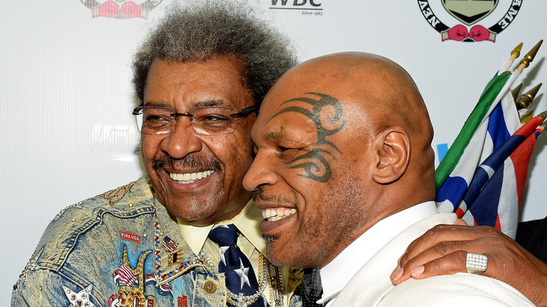 Don King, Mike Tyson, both smiling