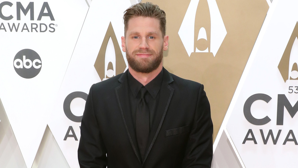 Chase Rice smiling at the CMA Awards 