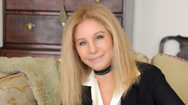 Barbra Streisand posing aftere receiving a leadership award in 2023