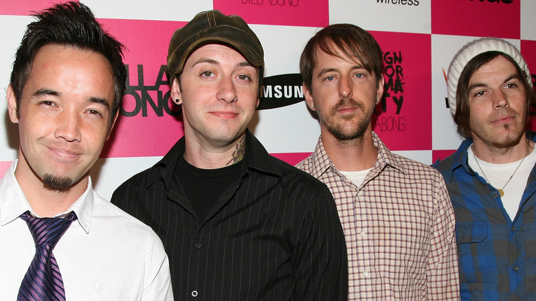 Hoobastank standing in front of a checkered wall 