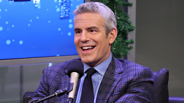 Andy Cohen speaking into a microphone