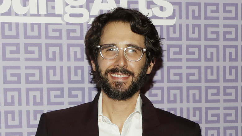 Josh Groban wearing glasses and smiling