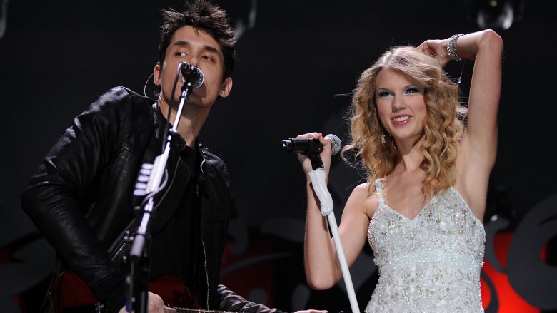 John Mayer performing onstage with Taylor Swift