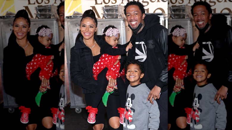 Brittany Bell, Nick Cannon, and their two children smiling