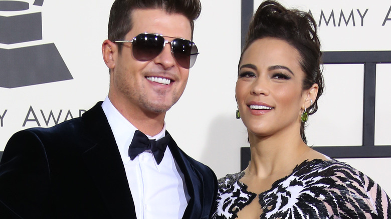 Robin Thicke and Paula Patton smiling