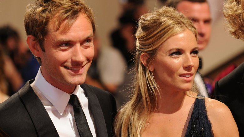 Sienna Miller and Jude Law smiling