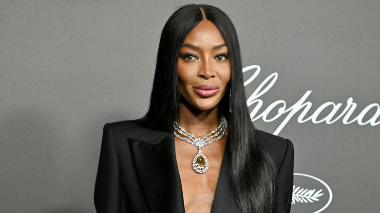 Naomi Campbell poses on a red carpet