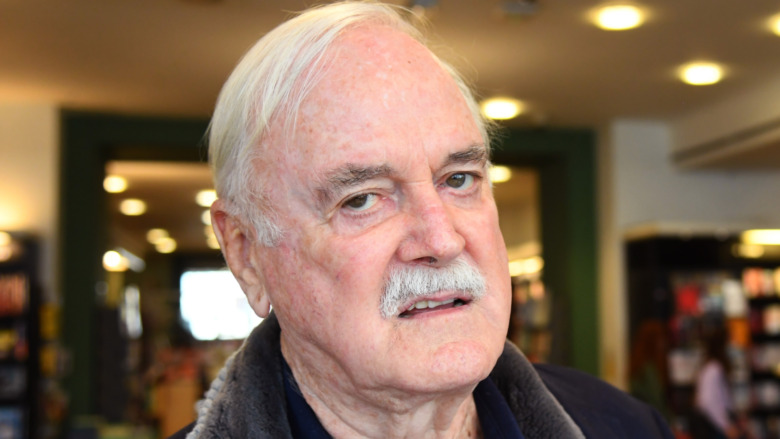 John Cleese sneering