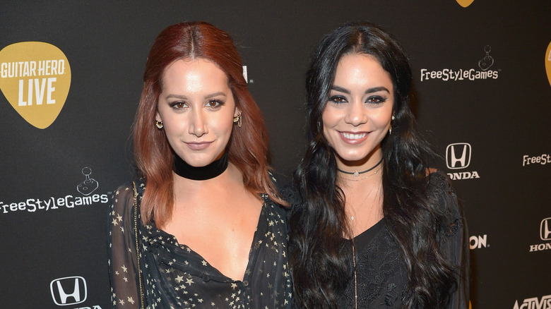 Ashley Tisdale and Vanessa Hudgens in black outfits 