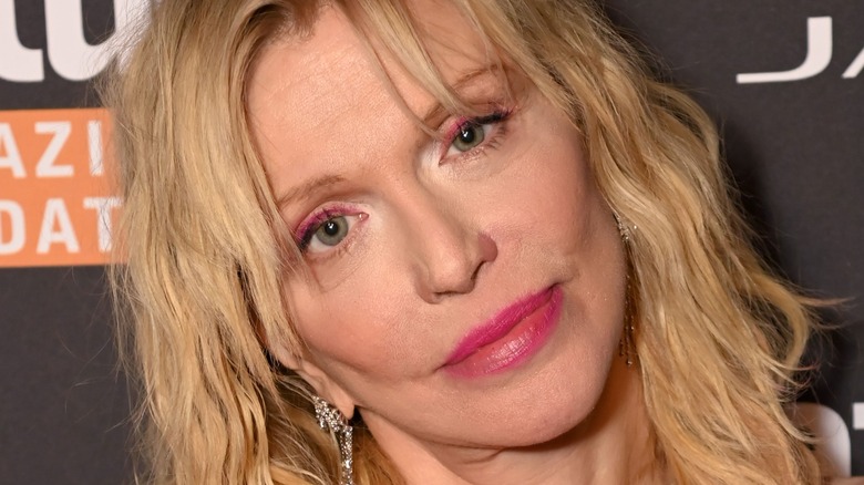 Courtney Love with head cocked at an event