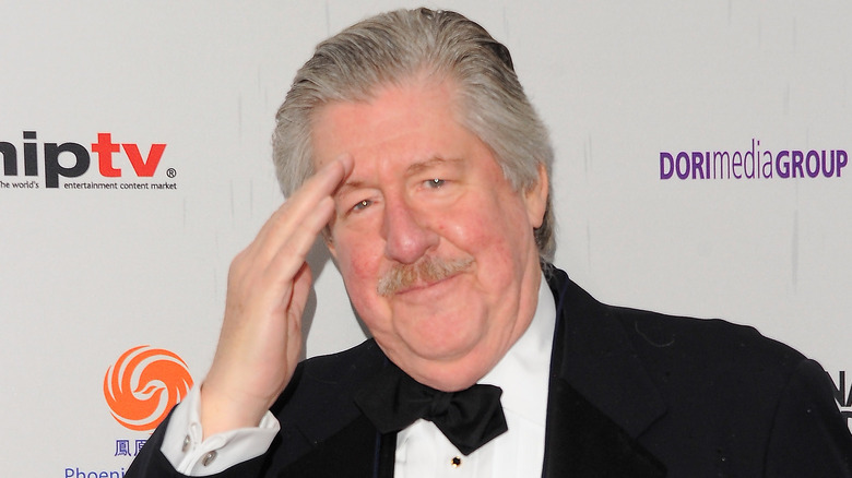 Edward Herrmann saluting