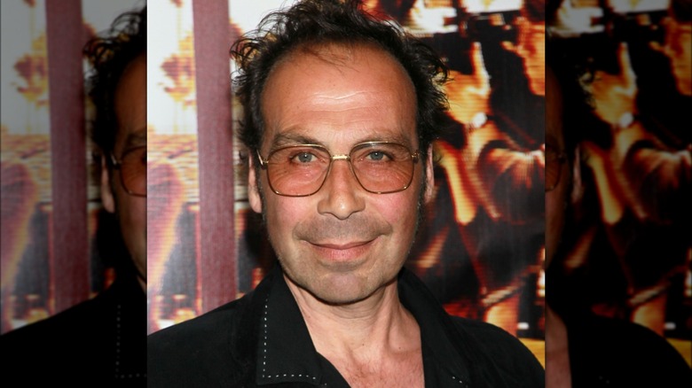 Taylor Negron wearing rimmed glasses
