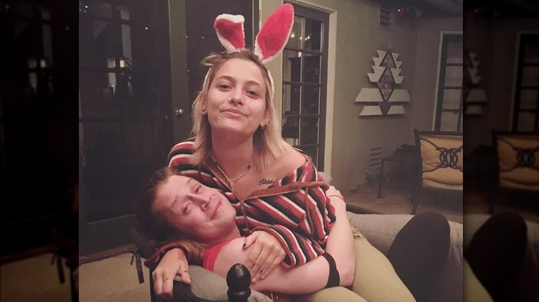 Macaulay Culkin embracing Paris Jackson