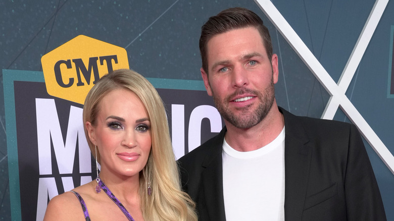 Carrie Underwood and Mike Fisher smiling