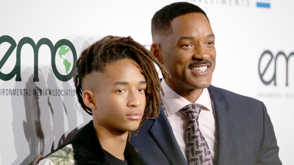 Jaden Smith and Will Smith standing next to each other on the red carpet