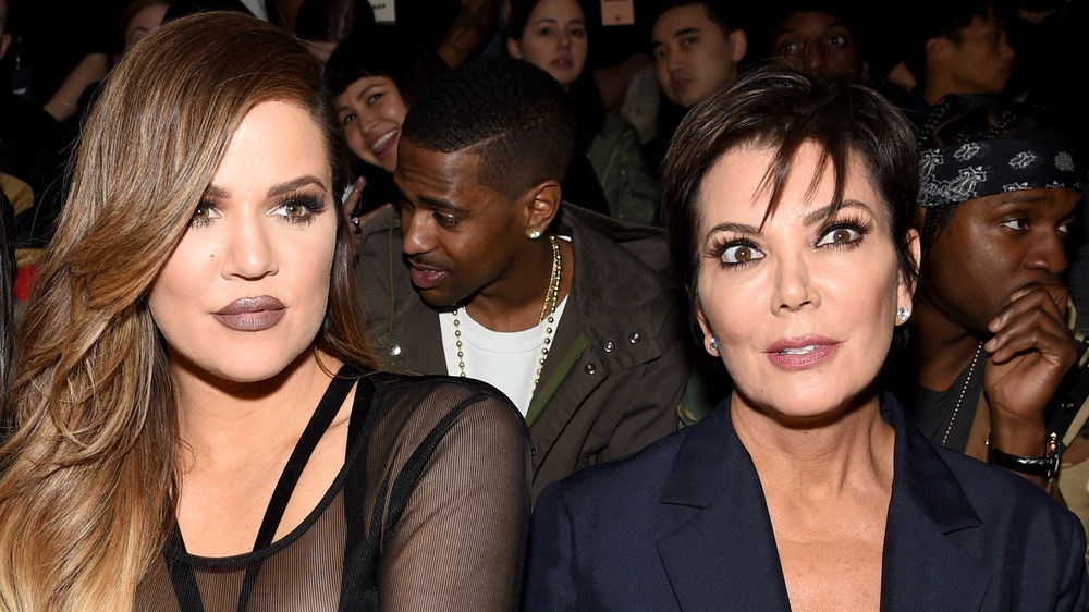 Khloe Kardashian and Kris Jenner sitting next to each other