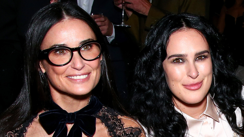 Demi Moore and Rumer Willis sitting next to each other smiling