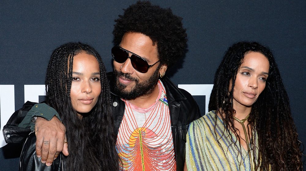 Zoe Kravitz, Lenny Kravitz and Lisa Bonet standing next to each other on the red carpet