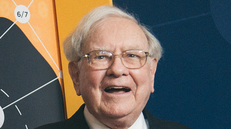 Warren Buffett posing for a photo